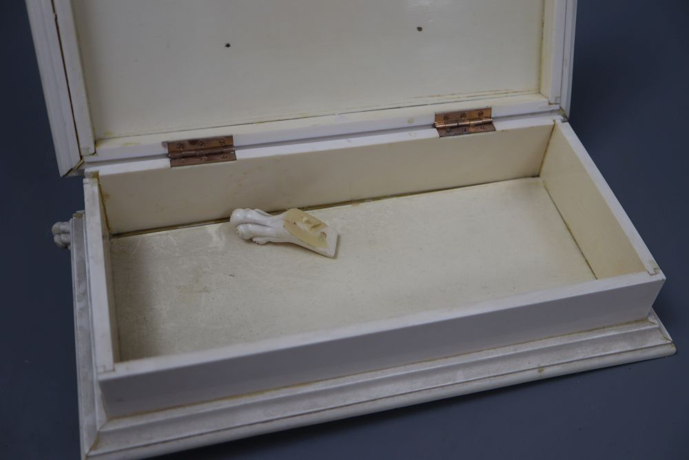 An ivory box with gold hinges, width 17cm height 8cm